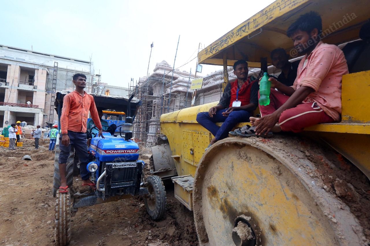Workers take a sip of water during their break | Photo: Praveen Jain | ThePrint