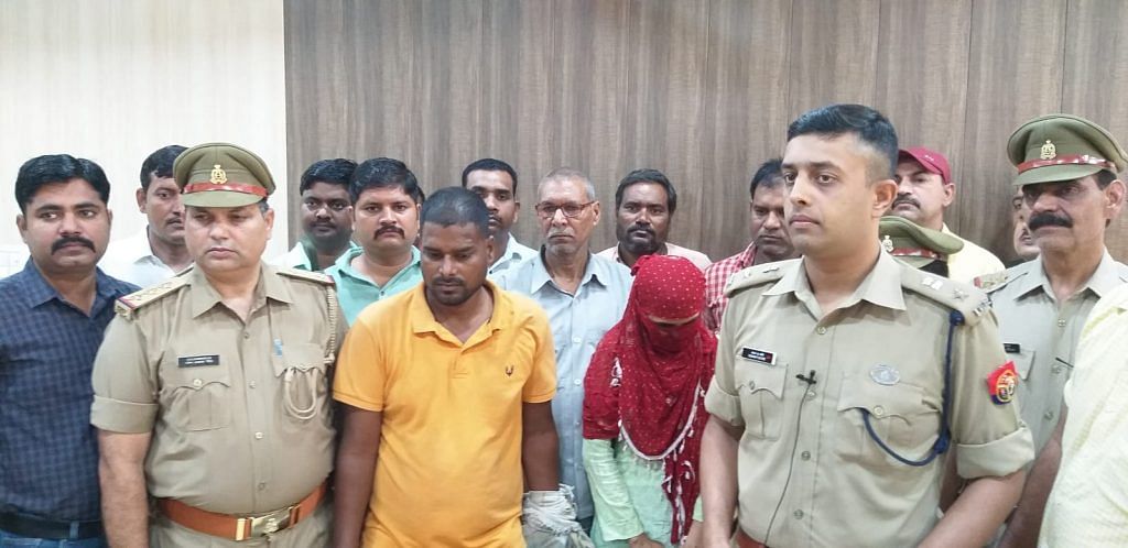 UP Police with Rajesh (yellow shirt) and his alleged lover Ruby (face covered) following their arrests | By special arrangement
