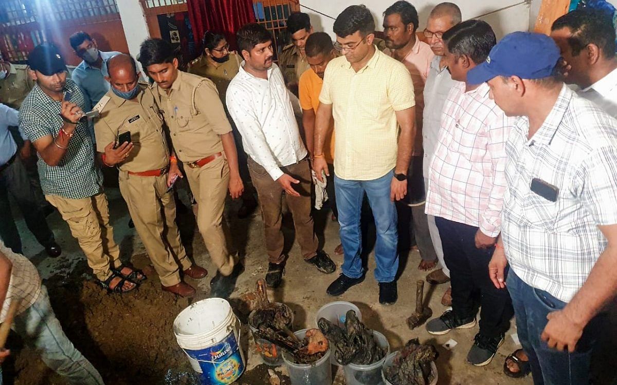 Police exhuming the body of Rajnesh and her children, Avni and Arpit | By special arrangement