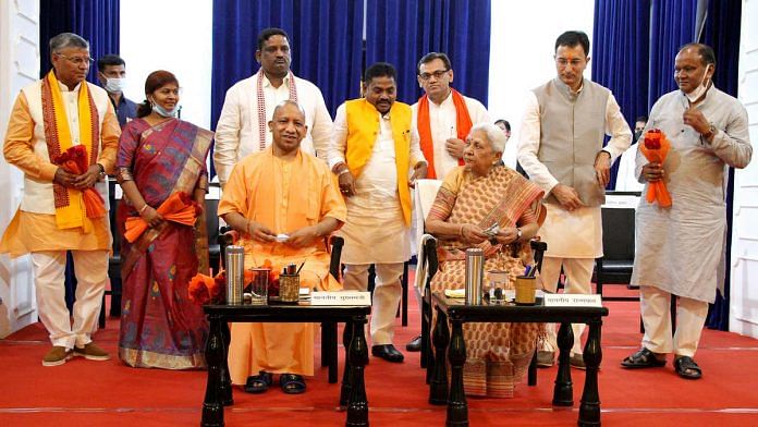 UP Chief Minister Yogi Adityanath (seated left) and Governor Anandiben Patel (seated right) with the newly inducted ministers in Lucknow Sunday | Photo: ANI