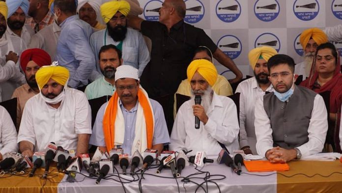 Arvind Kejriwal and Bhagwant Mann, with others, at an event in August | Twitter | @AAPPunjab