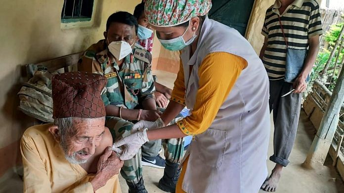 A medic administers Covid vaccine to an elderly man in Kangpokpi, Manipur | ANI