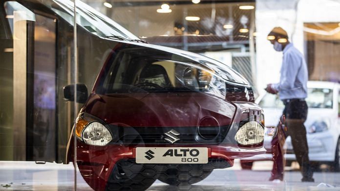 A Maruti Suzuki Alto at one of the automaker's showrooms in New Delhi | Bloomberg Photo