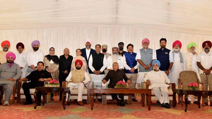 The new Punjab cabinet with CM Charanjit Singh Channi (seated centre in red turban) and Governor Banwarilal Purohit (to his left) | Photo: PTI