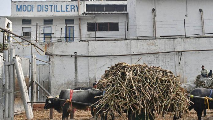 Sugarcane farmers wait with their bullock carts to unload their crop outside the Modi Sugar Mills in Modinagar, Uttar Pradesh | Photographer: Anindito Mukherjee | Bloomberg