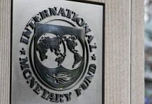 Signage displayed outside the IMF | Alex Wroblewski | Bloomberg