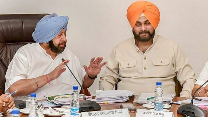 Punjab Chief Minister Captain Amarinder Singh with Navjot Singh Sidhu during a Cabinet meeting in Chandigarh | PTI