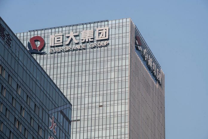 Evergrande Group logo atop the company's headquarters in Shenzhen, China, on 30 September 2021 | Photo: Gilles Sabrie | Bloomberg