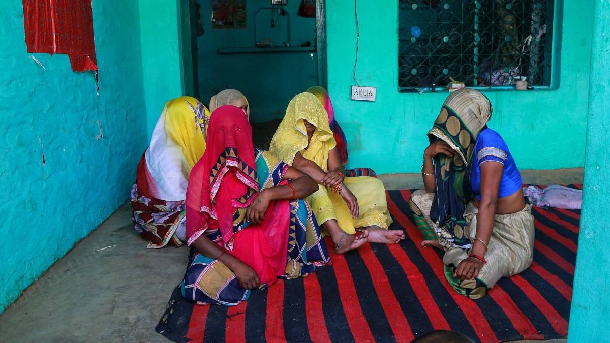 Relatives of the 16-year-old Dalit girl outside her home at Kirra village in Bulandshahr | Manisha Mondal | ThePrint