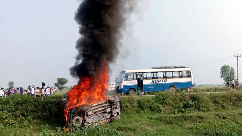 A vehicle set ablaze at Lakhimpur Kheri during the 3 October violence | ANI photo
