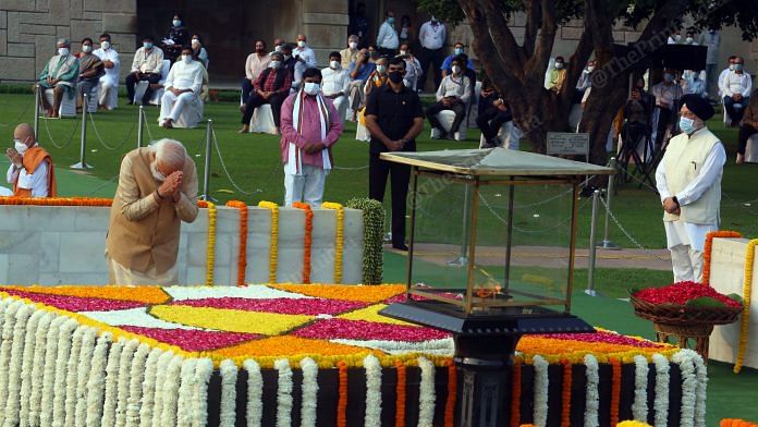 Prime Minister Narendra Modi pays homage to Mahatma Gandhi on the occasion of his birth anniversary, at Rajghat in New Delhi | Photo: Praveen Jain | ThePrint