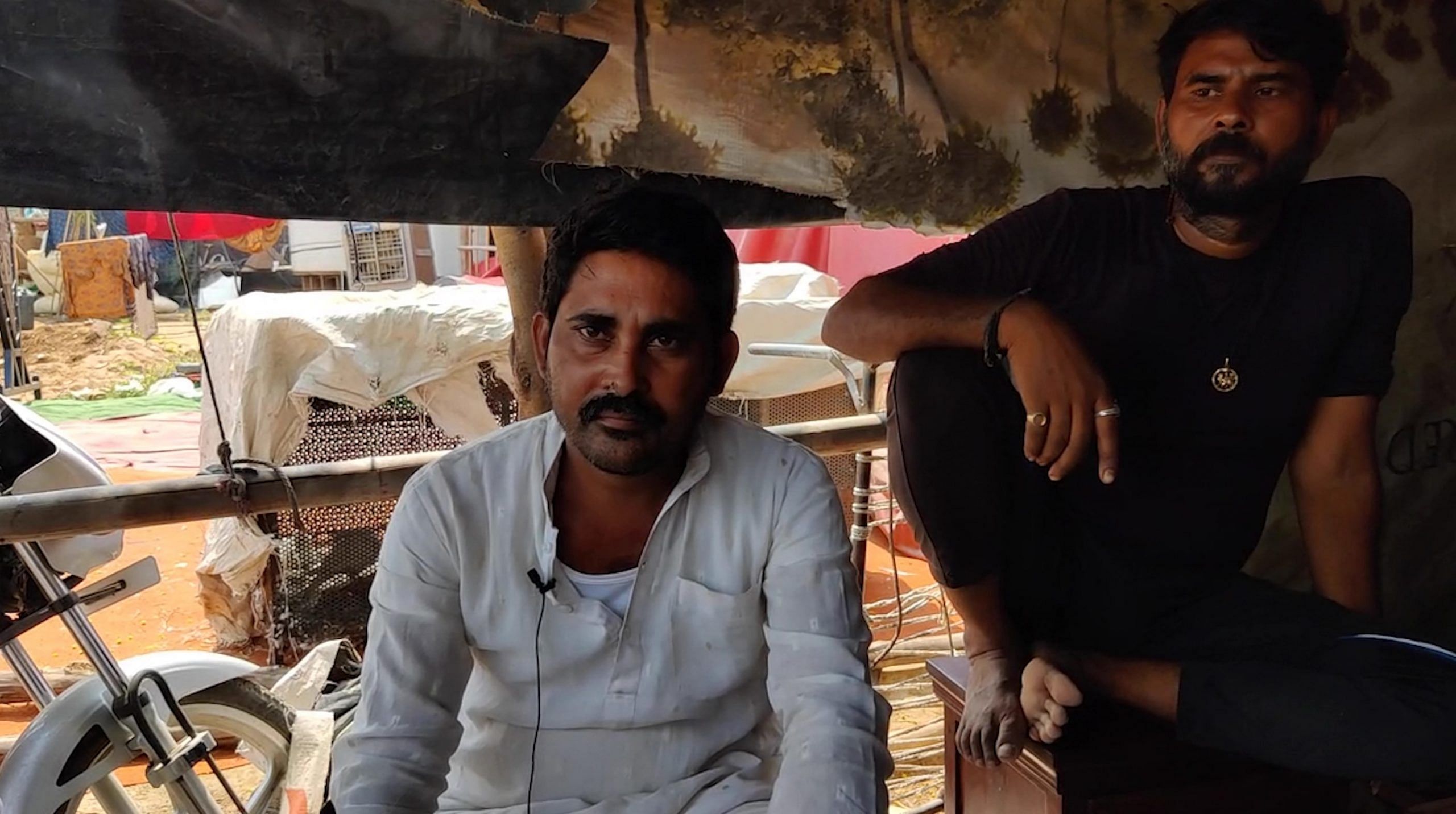 Satish (left, in white shirt) is a local vendor and leader at the Banjara market | Photo: Reeti Agarwal