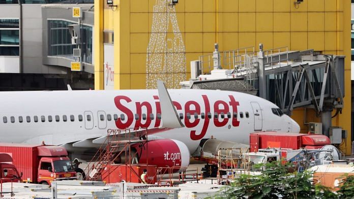 A SpiceJet Ltd aircraft stands at Terminal 3 of IGI airport in New Delhi (representational image) | Photographer: T. Narayan | Bloomberg