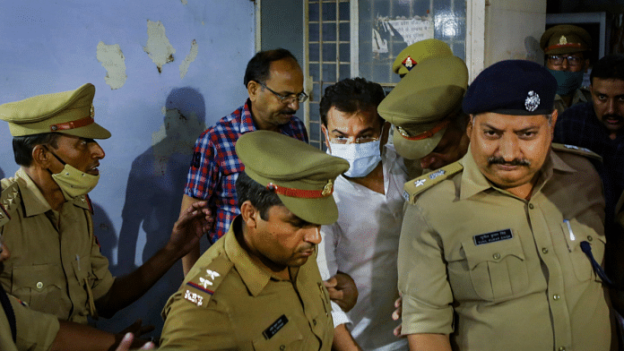 Ashish Mishra being taken from the crime branch office to be produced before a magistrate in Lakhimpur Kheri, on 9 October 2021 | PTI photo