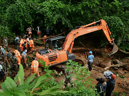 Rapid Action Force and Kerala Fire and Rescue personnel during rescue operations at the site of landslide at Kavali in Kottayam district, on 17 October 2021 | PTI Photo