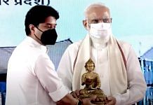Civil Aviation Minister Jyotiraditya Scindia felicitates Prime Minister Narendra Modi during the inauguration of Kushinagar International Airport today| PTI