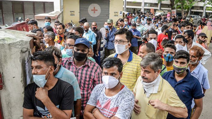 Beneficiaries wait to receive a dose of Covid-19 vaccine at Civil Hospital in Jalandhar on 4 October 2021| PTI