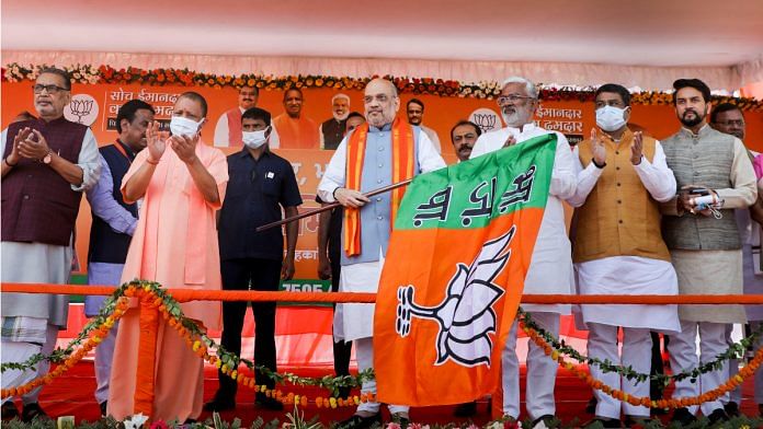 Union Home Minister Amit Shah flags off a campaign vehicle during Mera Pariwar Bhajpa Pariwar campaign in Lucknow on 29 October 2021| PTI