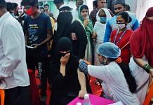 Beneficiaries wait to receive Covid-19 vaccine at a vaccination camp organised in Mumbai on 28 October 2021| PTI