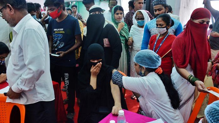 Beneficiaries wait to receive Covid-19 vaccine at a vaccination camp organised in Mumbai on 28 October 2021| PTI