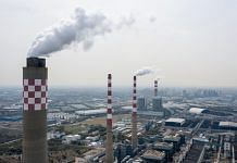 Exhaust rises from the smoke stacks of thermal power plants in this aerial photograph taken in Changshu, Jiangsu Province, China| Bloomberg