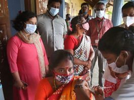 A medic administers a dose of Covid-19 vaccine to a beneficiary at Nagercoil in Kanyakumari district on 10 October 2021| PTI
