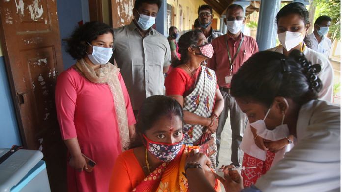 A medic administers a dose of Covid-19 vaccine to a beneficiary at Nagercoil in Kanyakumari district on 10 October 2021| PTI