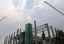 Cranes operate at a construction site at the Pragati Maidan exhibition grounds in New Delhi | Representational image | Bloomberg