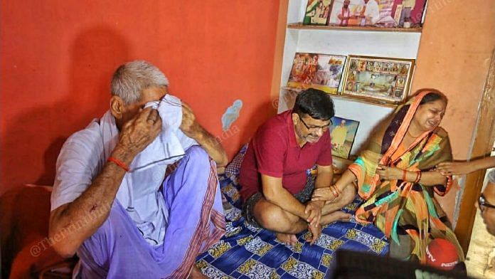 (From L) BJP block president Shubham Mishra's grandfather Shyam Manohar, father Vijay Mishra and mother Sushma at their house in Lakhimpur city | Praveen Jain | ThePrint