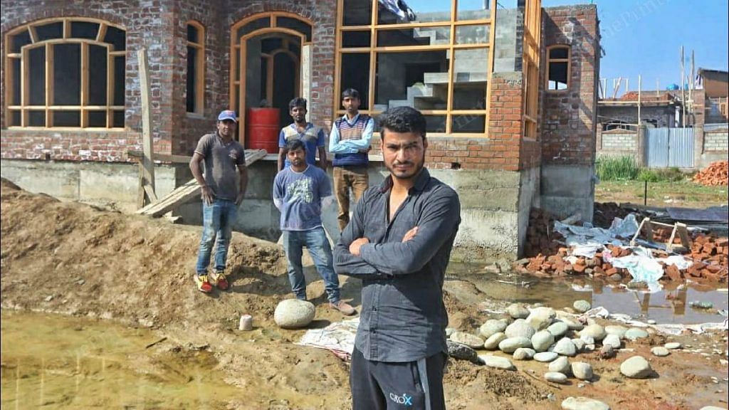 Sameer Wani, a local contractor in Eidgah, with a group of migrant workers he brought to Kashmir | Praveen Jain | ThePrint