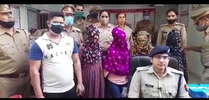 The arrested accused with Ghaziabad police officers. | By special arrangement