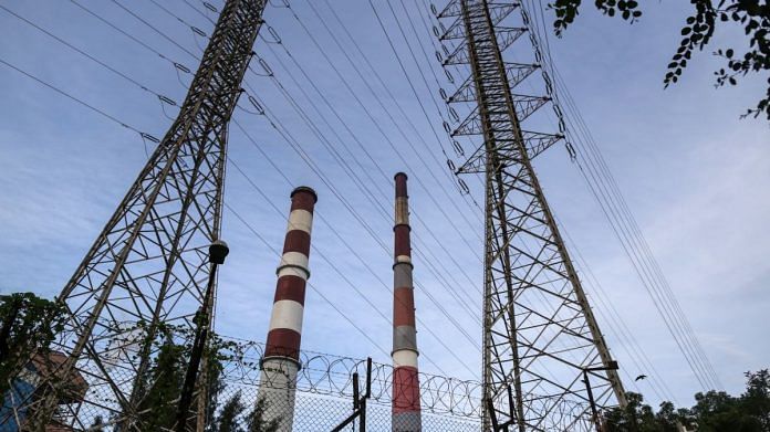 Electricity pylons and chimneys at the Tata Power Co. Trombay Thermal Power Station in Mumbai | Bloomberg
