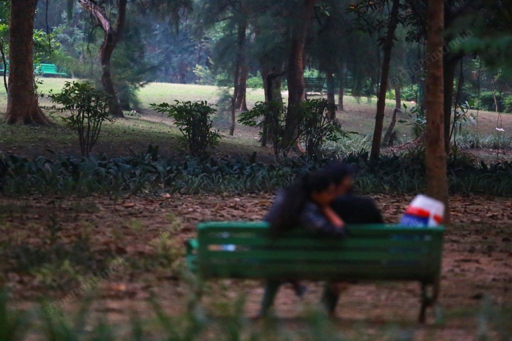 At Lodhi Garden, a couple sit on a bench in the evening | Photo: Manisha Mondal | ThePrint