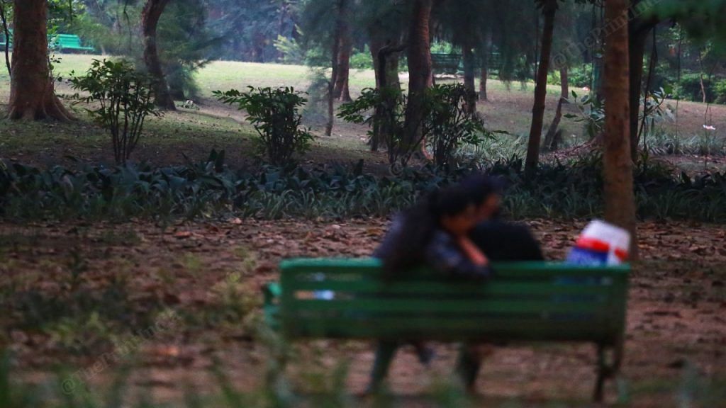 At Lodhi Garden, a couple sit on a bench in the evening | Photo: Manisha Mondal | ThePrint