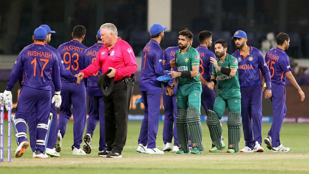 Pakistani batsmen and umpire Marais Erasmus greet Indian players after their T20 World Cup match in Dubai on 24 October | Photo: ANI