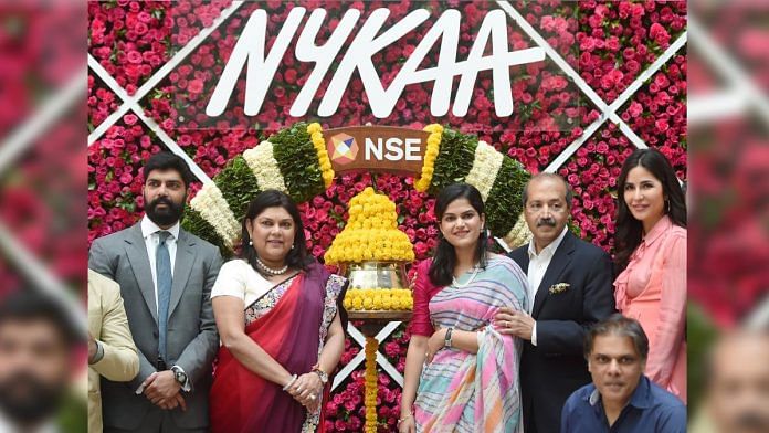 Falguni Nayar (C-L), MD and CEO of Nykaa, along with her daughter Advaita (C-R), Bollywood actress Katrina Kaif and others attends the company's IPO listing ceremony at the NSE in Mumbai, on 10 November 2021 | PTI