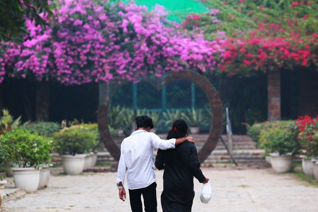 At Lodhi Garden a couple walks holding each other | Photo: Manisha Mondal | ThePrint
