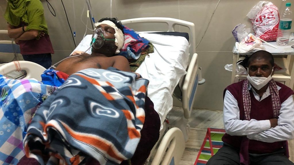 Victim Ashok Saket on his hospital bed in Rewa, MP | Photo: Jyoti Yadav | ThePrint