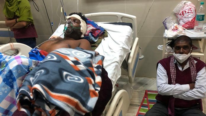 Victim Ashok Saket on his hospital bed in Rewa, MP | Photo: Jyoti Yadav | ThePrint