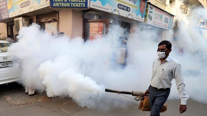 A worker fumigates the streets in an attempt to contain the dengue outbreak, at Gole market, in New Delhi on 28 October 2021 | ANI photo