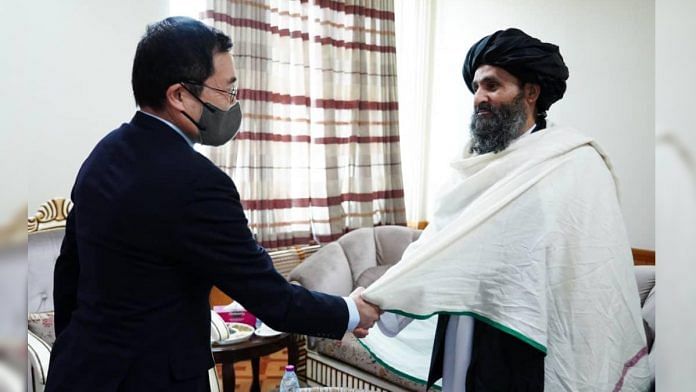 Japanese Ambassador to Afghanistan Takashi Okada, left, with Taliban leader Mullah Abdul Ghani Baradar in Kabul, on 24 November 2021 | Twitter/@IeaOffice