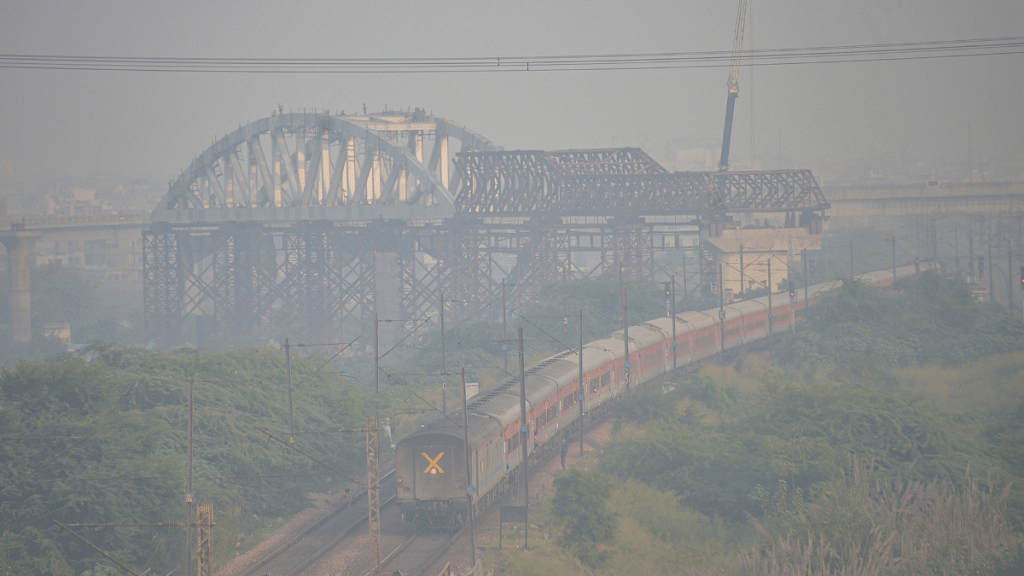 A train makes its way amid low visibility due to thick smog in Ghaziabad in late 2021 | PTI Photo