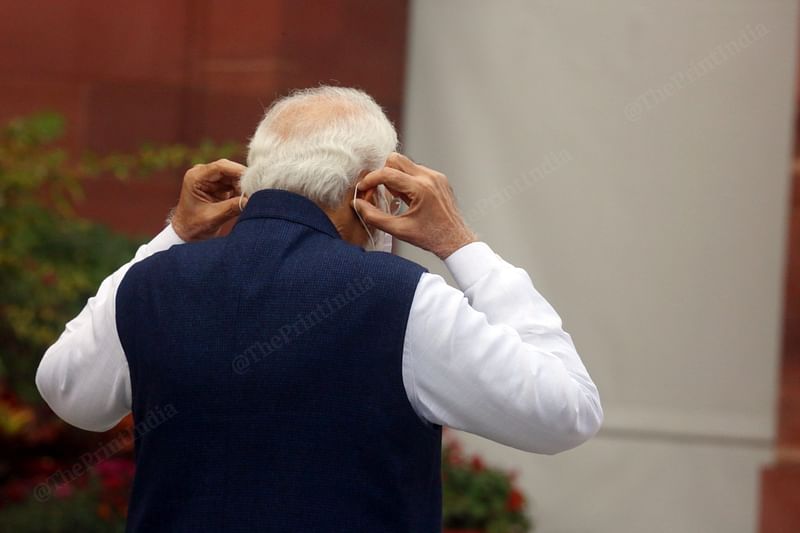 Prime Minister Narendra Modi wearing a mask after addressing media at Parliament House | Photo: Praveen Jain | ThePrint