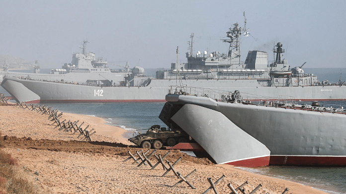 A BTR-82A armored personnel carrier lands from a ship during an amphibious landing exercise, in Crimea on 18 October | Bloomberg
