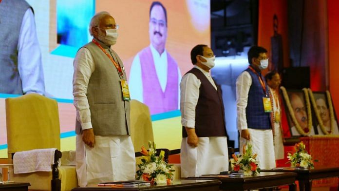 Prime Minister Narendra Modi (left) with BJP chief J.P. Nadda and Union minister Piyush Goyal at the party's National Executive meeting in New Delhi Sunday | Photo: Suraj Singh Bisht | ThePrint