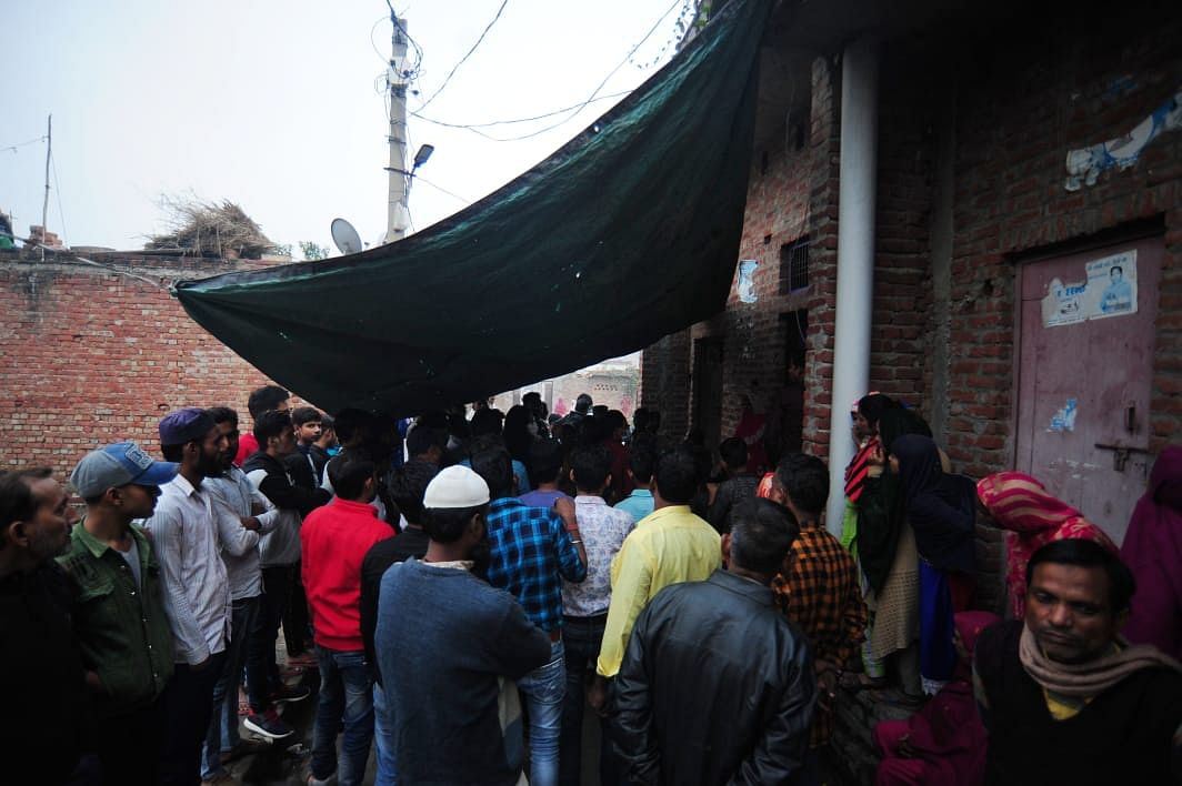 Relatives of Altaf outside his home in Kasganj | Photo: Suraj Singh Bisht/ThePrint 