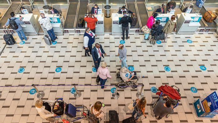 People at the departures terminal at Cape Town International Airport in Cape Town, on 31 March 2021 | Representational image | Bloomberg File Photoa