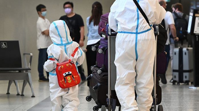 International travellers wearing PPE arrive at Melbourne's Tullamarine Airport on 29 November 2021 | Representational image | Photographer: William West/AFP/Getty Images via Bloomberg