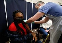 Representational image | File photo of a woman receiving a Covid vaccine in London | Bloomberg
