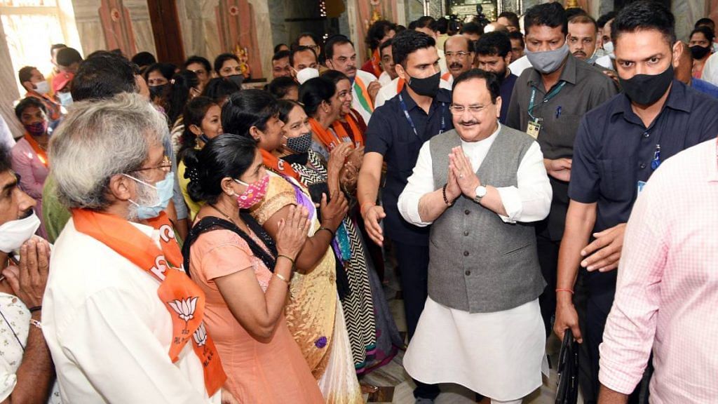 BJP national president J.P. Nadda greets party supporters during a visit to a temple in Panaji on November 25 | ANI
